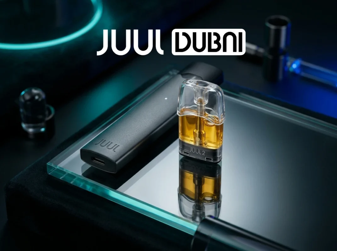 A sleek, dark aesthetic shot of a genuine JUUL 2 device and a clear pod showing golden amber e-liquid color[cite: 2].
