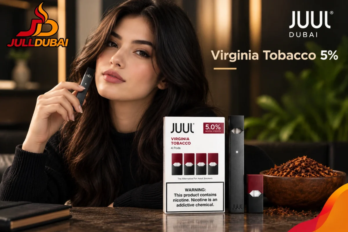 JUUL Virginia Tobacco 5% four-pod pack and original JUUL device beside a model, with JUUL Dubai branding